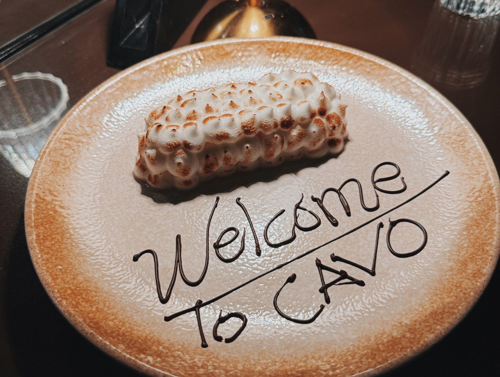 Dessert plate with Welcome to CAVO written in chocolate