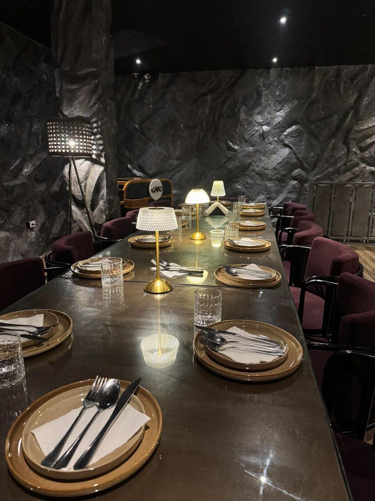 A long table set for a party on the upper floor