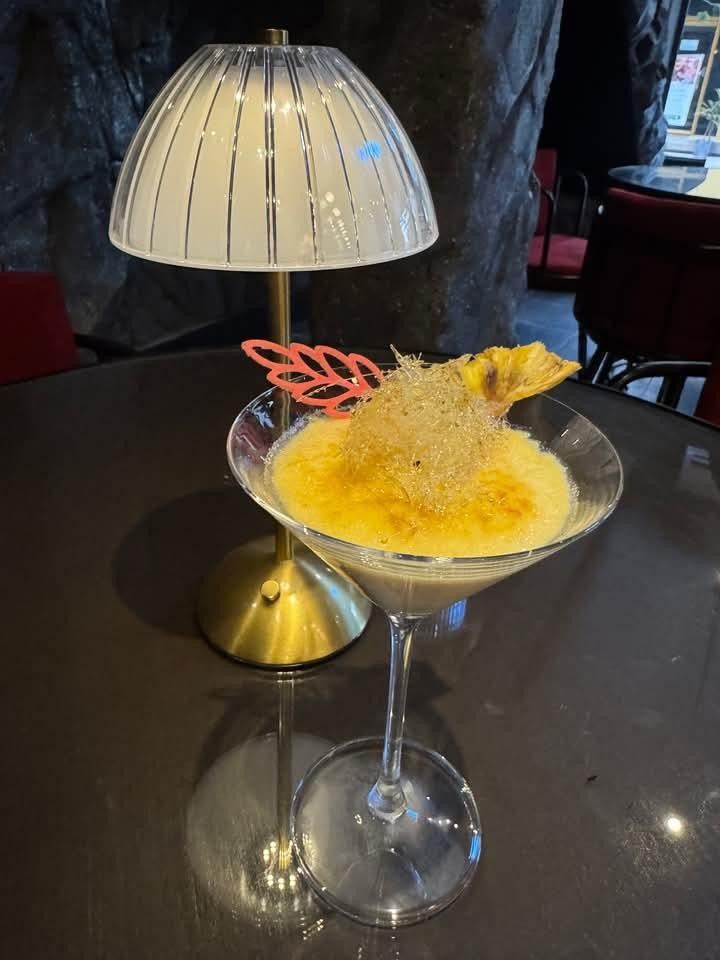 Creme brulee with a torched top, served in a martini glass